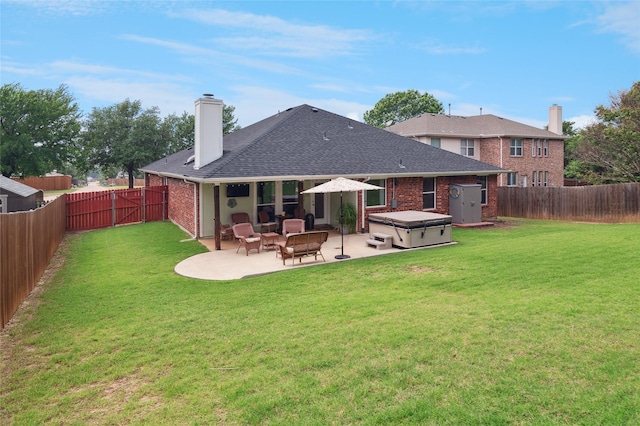 2630 Argyle Shore Dr, Rockwall, TX 75087 - rear view of house featuring a hot tub, a patio, a chimney, and brick siding