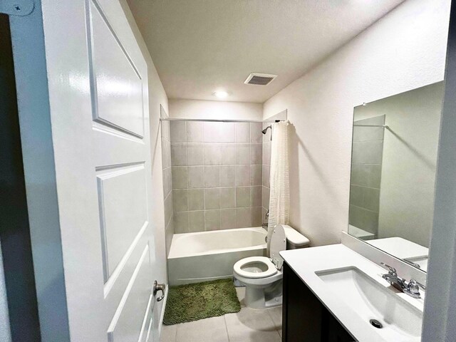 7425 Bledington Ln, Mckinney, TX 75071 - bathroom featuring tile patterned floors, toilet, vanity, and shower / tub combination