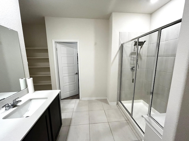 7425 Bledington Ln, Mckinney, TX 75071 - bathroom with a stall shower, tile patterned floors, vanity, and baseboards