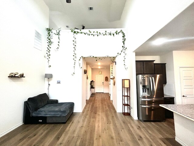 7425 Bledington Ln, Mckinney, TX 75071 - hallway featuring light wood-style floors and baseboards