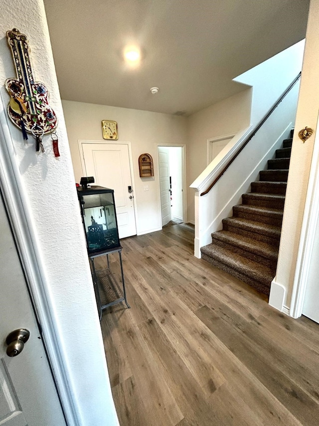 7425 Bledington Ln, Mckinney, TX 75071 - foyer with stairs and wood finished floors