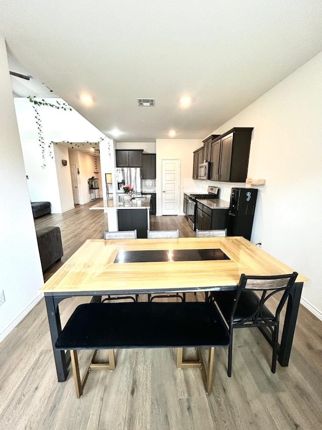 7425 Bledington Ln, Mckinney, TX 75071 - dining area featuring wood finished floors and baseboards