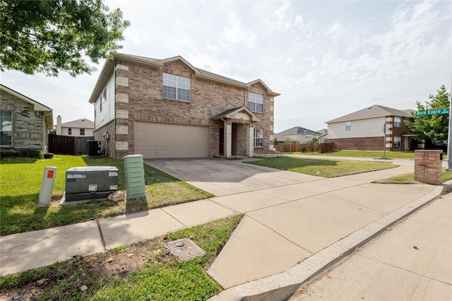 8537 Star Thistle Dr, Fort Worth, TX 76179 - traditional home with an attached garage, concrete driveway, brick siding, and central air condition unit