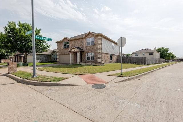 8537 Star Thistle Dr, Fort Worth, TX 76179 - traditional-style house featuring brick siding, an attached garage, and driveway