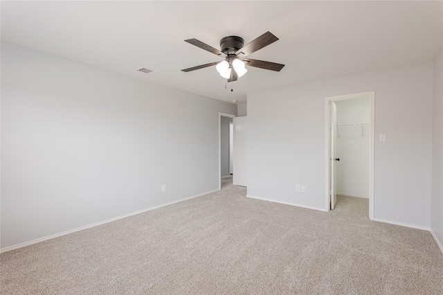 8537 Star Thistle Dr, Fort Worth, TX 76179 - unfurnished bedroom featuring light colored carpet, baseboards, a walk in closet, a closet, and ceiling fan