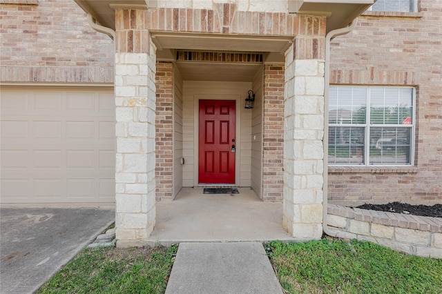 8537 Star Thistle Dr, Fort Worth, TX 76179 - doorway to property featuring brick siding and a garage