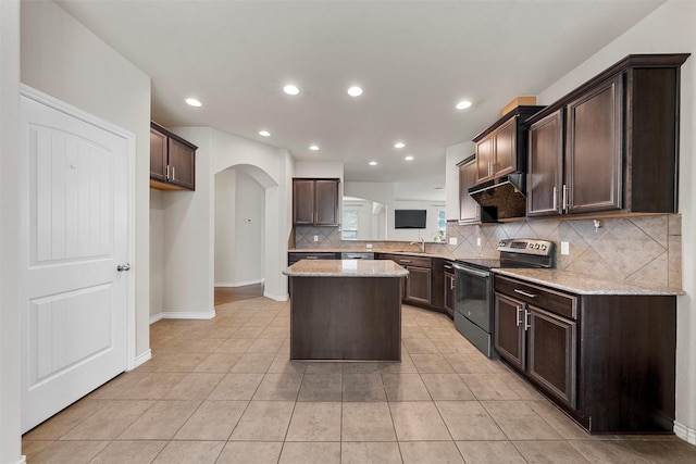 5541 Wisdom Ct, Waco, TX 76708 - kitchen featuring stainless steel electric range, decorative backsplash, arched walkways, dark brown cabinets, and recessed lighting