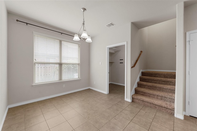 5541 Wisdom Ct, Waco, TX 76708 - unfurnished dining area with a chandelier, stairs, light tile patterned floors, and baseboards