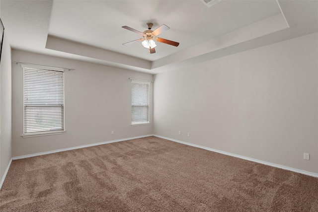 5541 Wisdom Ct, Waco, TX 76708 - empty room featuring a raised ceiling, carpet, a ceiling fan, and baseboards