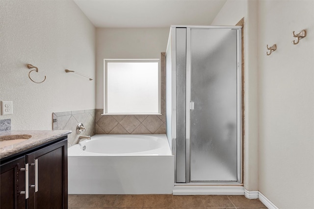 5541 Wisdom Ct, Waco, TX 76708 - bathroom with a stall shower, tile patterned flooring, a bath, and vanity