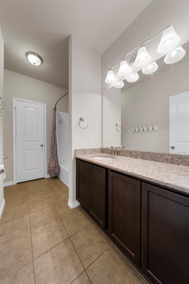 5541 Wisdom Ct, Waco, TX 76708 - full bathroom with shower / bathtub combination with curtain, tile patterned floors, vanity, and baseboards