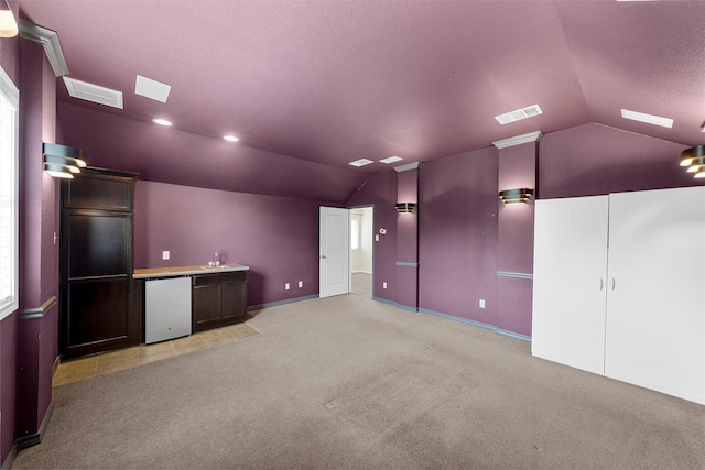 5541 Wisdom Ct, Waco, TX 76708 - cinema featuring lofted ceiling, a textured ceiling, light colored carpet, and baseboards