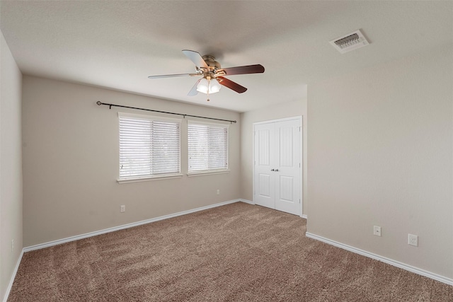 5541 Wisdom Ct, Waco, TX 76708 - unfurnished bedroom with carpet floors, a closet, baseboards, and a ceiling fan