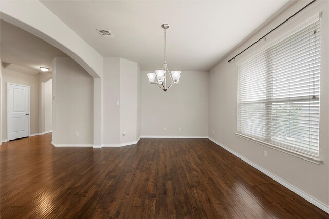 5541 Wisdom Ct, Waco, TX 76708 - unfurnished room featuring arched walkways, dark wood-style floors, a chandelier, and baseboards