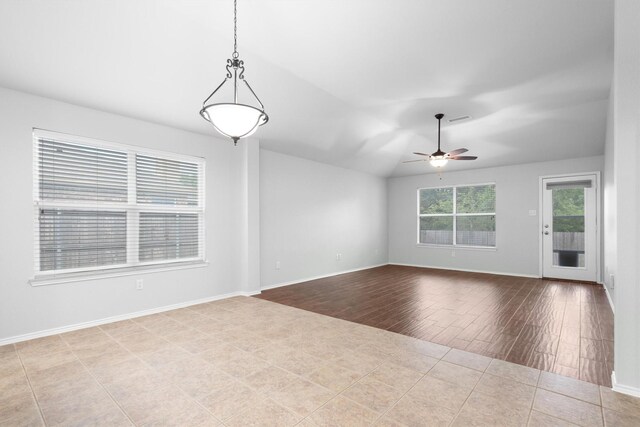 3432 Beatriz Dr, Denton, TX 76207 - unfurnished room with a ceiling fan, wood finished floors, baseboards, and vaulted ceiling