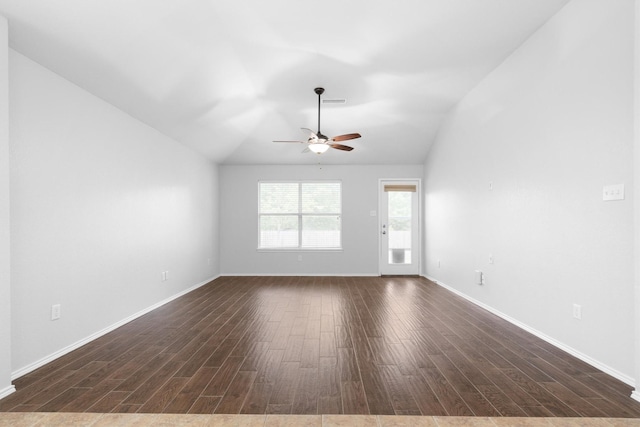 3432 Beatriz Dr, Denton, TX 76207 - empty room featuring dark wood-style flooring, a ceiling fan, vaulted ceiling, and baseboards
