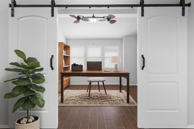 3432 Beatriz Dr, Denton, TX 76207 - home office with a barn door, dark wood finished floors, and ceiling fan