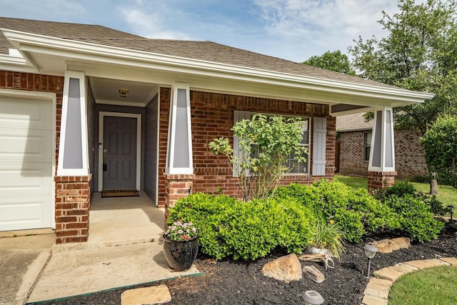 3432 Beatriz Dr, Denton, TX 76207 - view of exterior entry with brick siding, covered porch, and roof with shingles