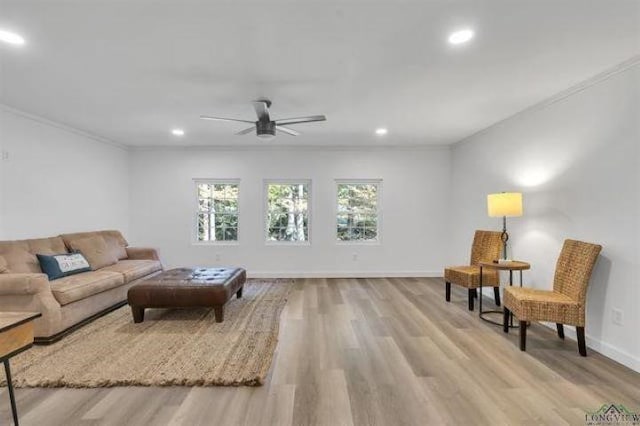 228 Stuart Dr, Karnack, TX 75661 - living area featuring wood finished floors, crown molding, recessed lighting, ceiling fan, and baseboards