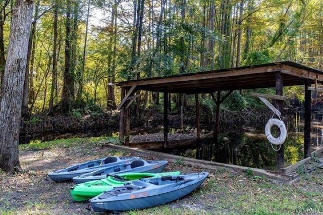228 Stuart Dr, Karnack, TX 75661 - view of yard with a forest view