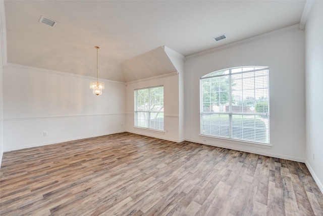 7002 Westover Dr, Rowlett, TX 75089 - unfurnished room featuring a chandelier, wood finished floors, crown molding, baseboards, and lofted ceiling