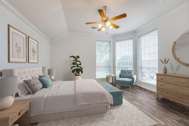 7002 Westover Dr, Rowlett, TX 75089 - bedroom with ornamental molding, multiple windows, wood finished floors, vaulted ceiling, and ceiling fan