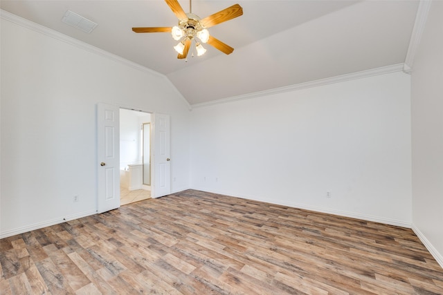 7002 Westover Dr, Rowlett, TX 75089 - spare room featuring wood finished floors, crown molding, ceiling fan, lofted ceiling, and baseboards