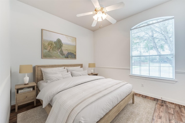 7002 Westover Dr, Rowlett, TX 75089 - bedroom featuring wood finished floors, baseboards, and a ceiling fan