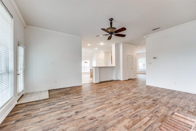 7002 Westover Dr, Rowlett, TX 75089 - unfurnished living room with light wood-style floors, a ceiling fan, crown molding, baseboards, and recessed lighting