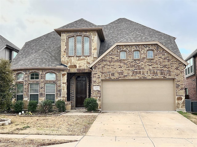 2095 Deckard, Princeton, TX 75407 - french country style house with a shingled roof, brick siding, driveway, and central air condition unit