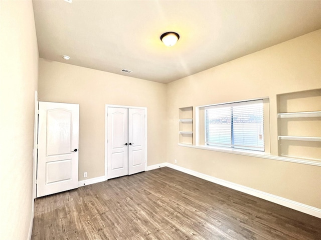 2095 Deckard, Princeton, TX 75407 - unfurnished bedroom with baseboards, wood finished floors, and a closet
