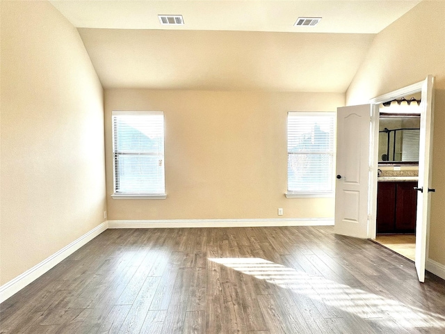 2095 Deckard, Princeton, TX 75407 - unfurnished bedroom with lofted ceiling, wood finished floors, multiple windows, and baseboards