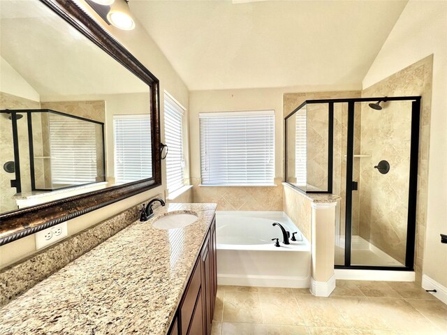2095 Deckard, Princeton, TX 75407 - bathroom with vaulted ceiling, a stall shower, a garden tub, vanity, and tile patterned flooring