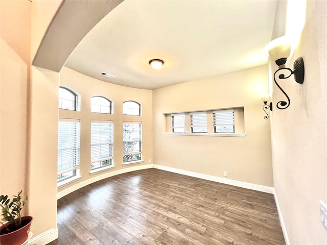 2095 Deckard, Princeton, TX 75407 - spare room with wood finished floors, healthy amount of natural light, and baseboards