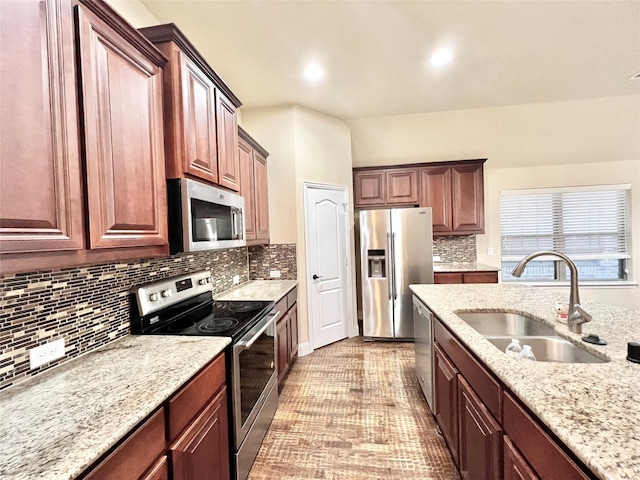 2095 Deckard, Princeton, TX 75407 - kitchen featuring stainless steel appliances, a sink, backsplash, light stone counters, and recessed lighting