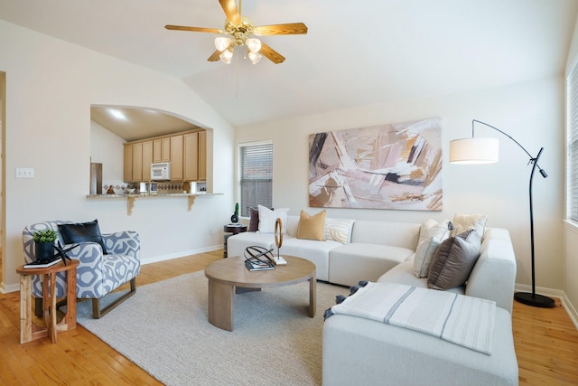 4525 Crooked Ridge Dr, The Colony, TX 75056 - living room featuring light wood-style floors, baseboards, and vaulted ceiling