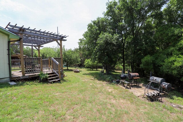 813 Sam Bass Rd, Mcgregor, TX 76657 - view of green lawn featuring a pergola and a deck