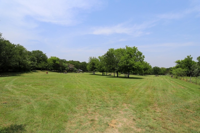 813 Sam Bass Rd, Mcgregor, TX 76657 - view of green lawn featuring a view of rural / pastoral area