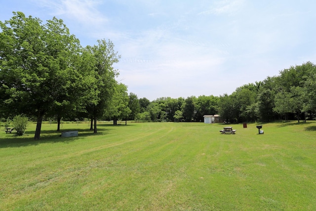 813 Sam Bass Rd, Mcgregor, TX 76657 - view of green lawn featuring an outbuilding