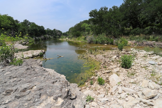 813 Sam Bass Rd, Mcgregor, TX 76657 - water view featuring a forest