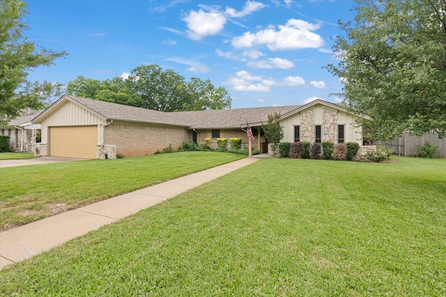 1247 Wedgewood Dr, Cleburne, TX 76033 - view of front of house with stone siding, an attached garage, and concrete driveway