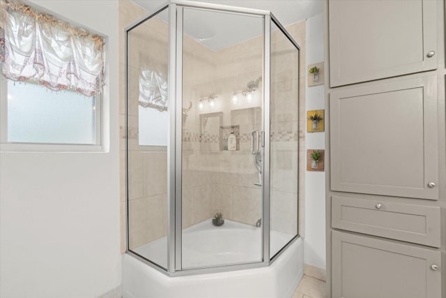 1247 Wedgewood Dr, Cleburne, TX 76033 - full bath with enclosed tub / shower combo, baseboards, and tile patterned floors