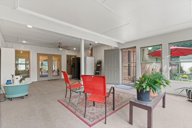 1247 Wedgewood Dr, Cleburne, TX 76033 - carpeted living room featuring healthy amount of natural light, french doors, and ceiling fan