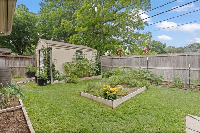 1247 Wedgewood Dr, Cleburne, TX 76033 - view of yard featuring a vegetable garden and an outdoor structure