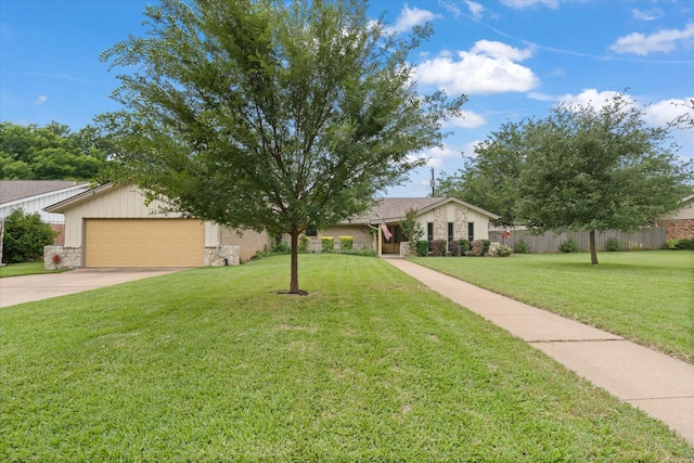 1247 Wedgewood Dr, Cleburne, TX 76033 - view of front of house with stone siding, concrete driveway, and a garage