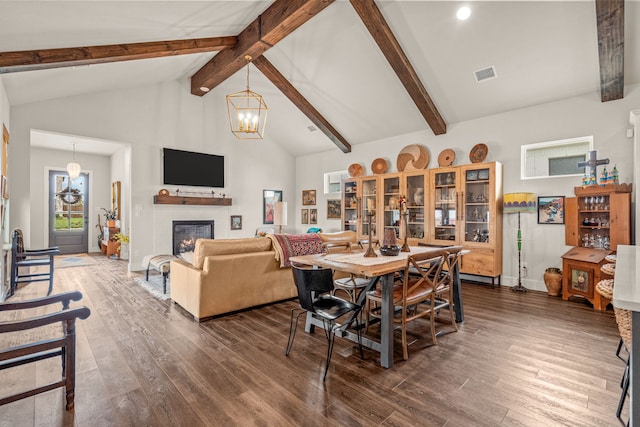 14344 Walsh Ave, Fort Worth, TX 76008 - dining area featuring wood finished floors, beam ceiling, a chandelier, a glass covered fireplace, and high vaulted ceiling