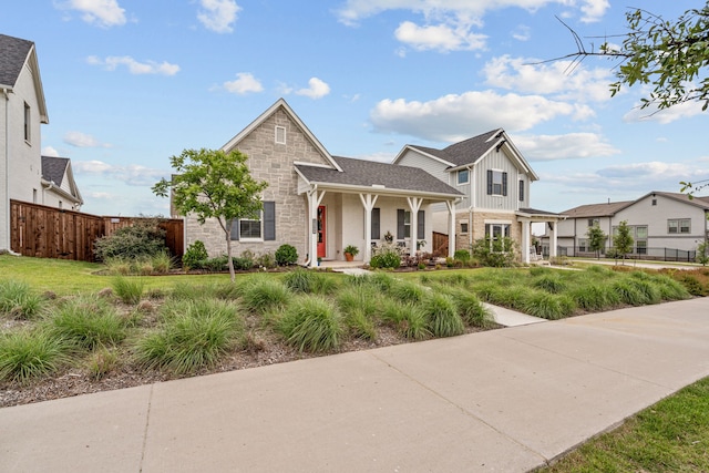 14344 Walsh Ave, Fort Worth, TX 76008 - traditional-style house with covered porch, board and batten siding, brick siding, and stone siding