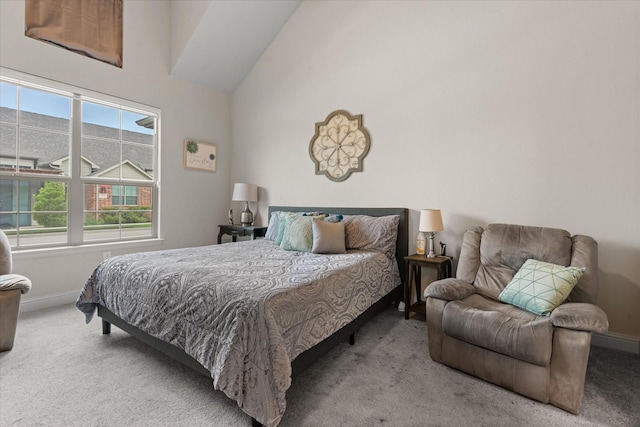 bedroom featuring carpet flooring, baseboards, and high vaulted ceiling
