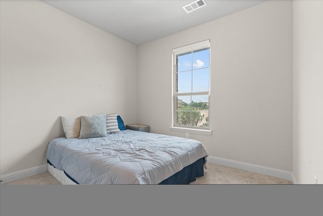 carpeted bedroom with baseboards