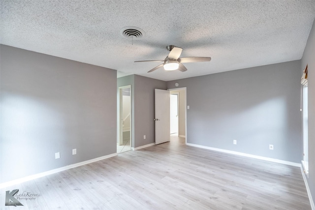 3242 Whitewing Way, Abilene, TX 79606 - empty room with a ceiling fan, light wood-style floors, baseboards, and a textured ceiling